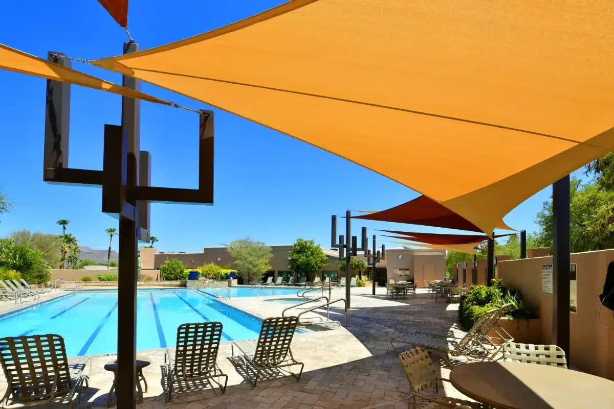 Orange shade sails over the pool deck at Rio Verde HOA