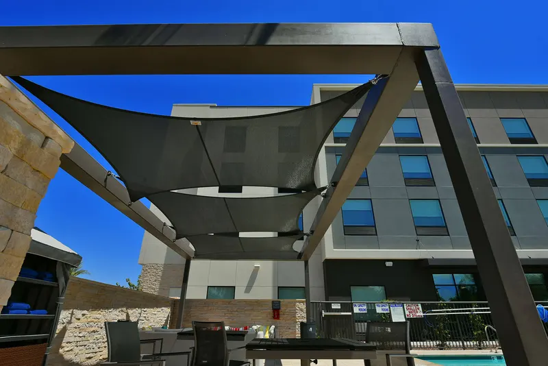 Upward view of shade panels within a freestanding frame.
